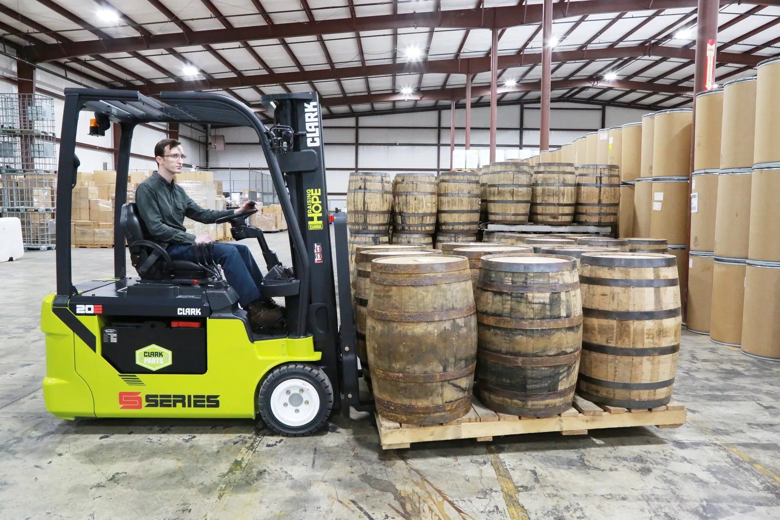 New Clark S-Series electric forklift moving barrels in a Delaware warehouse